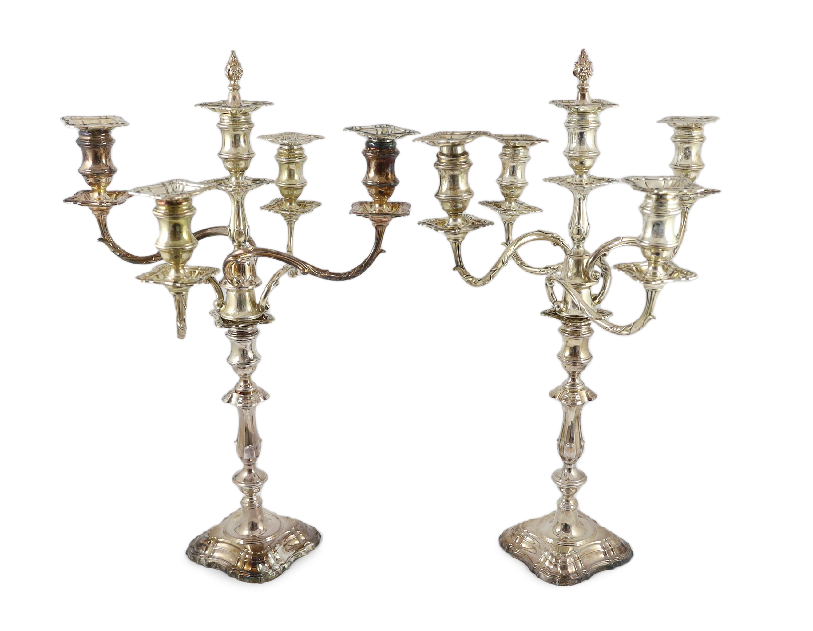 A good pair of George V silver four branch five light candelabra, by Elkington & Co.